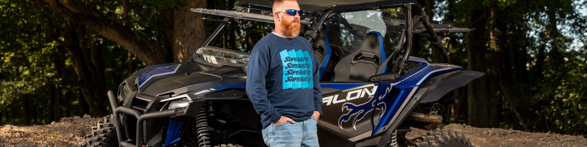 Image of a woman wearing a black long sleeve SuperATV t-shirt