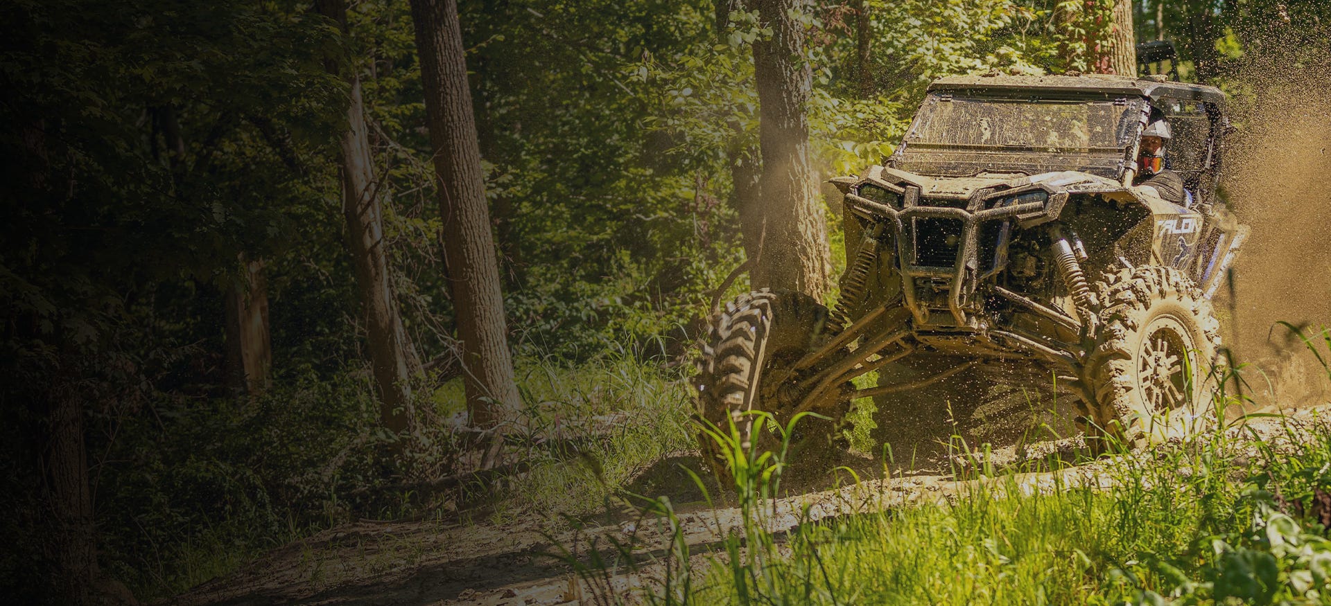 Muddy UTV with SuperATV Tubed Bumper installed