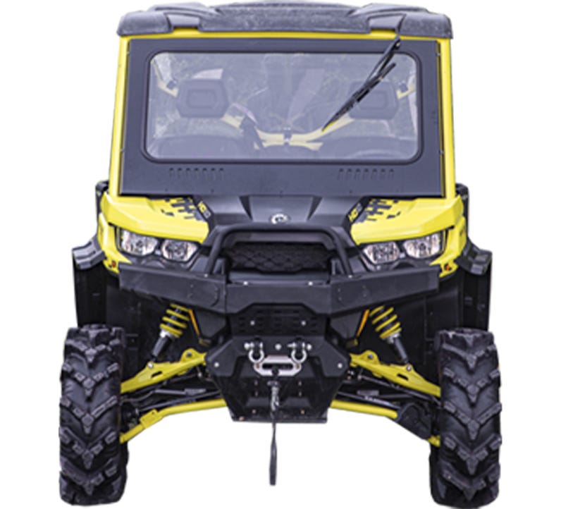 Image of a yellow Can-Am Defender UTV with a SuperATV Glass Windshield installed