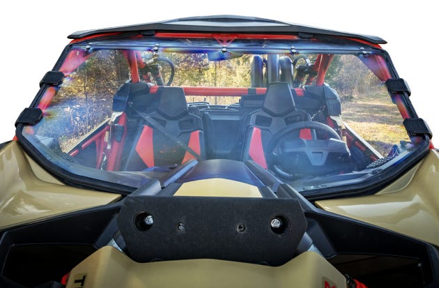 Closeup of a gold and black Can-Am Mav X3 UTV with a SuperATV full windshield installed.